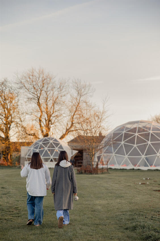 Close-up brand photo of a wellness guide’s hands during a mindfulness practice.