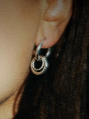 Untitled Close-up product detail: silver jewellery photographed during branding session.