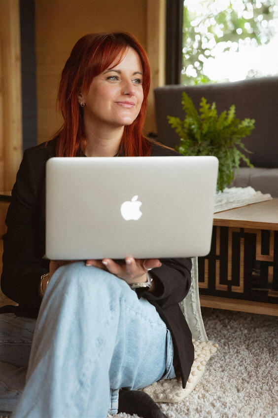 Personal brand portrait with laptop, looking away, Lincolnshire creative.